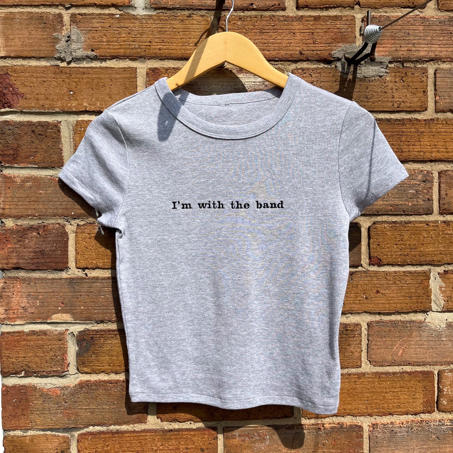 I’m with the band Embroidered Baby Tee